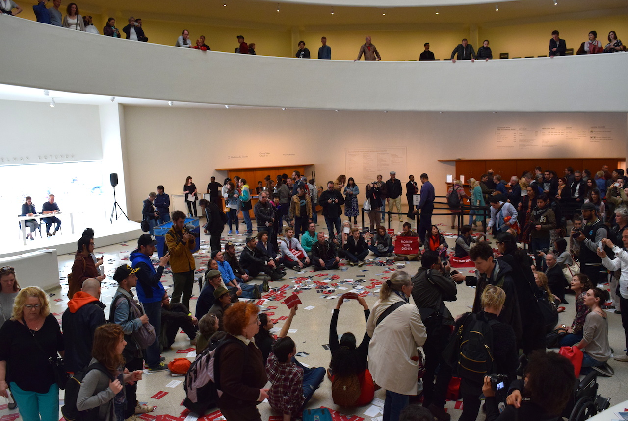 Protesters on the ground floor of the Guggenheim Museum.