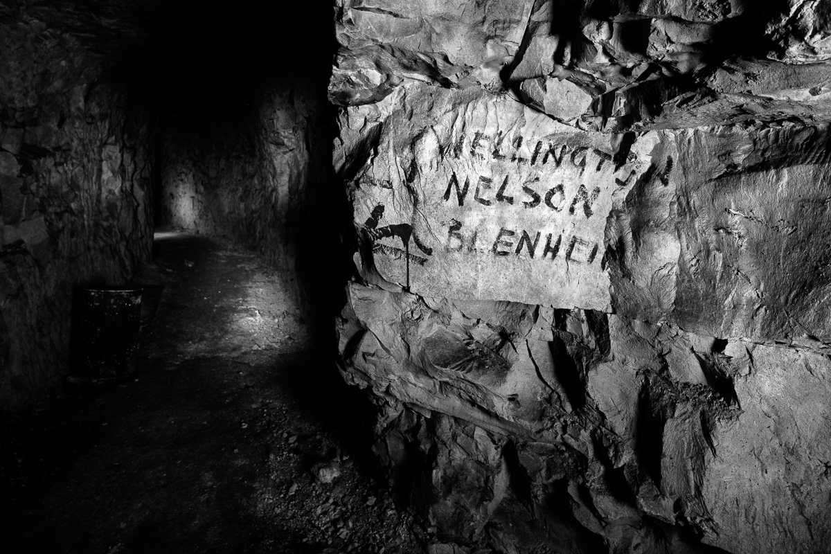 Street sign in underground WWI city. Photographed 26 January 2014. Nord-Pas-de-Calais, France. Copyright © 2014, Jeffrey Gusky. All Rights Reserved. Terms of Use: These photos are for one-time use before January 1, 2015, limited to professional media outlets and blogs, in connection with an accompanying story about Jeffrey Gusky, his work and WW1-related discoveries. Stories appearing during the license period may be archived online by the media outlet or blog who published the story. This image is a low resolution version of the original. Higher resolution images are available by special arrangement with the artist. This image may not be modified and may not be used commercially except with a commercial license. This image is not available under any Creative Commons license. Copyright (c) 2014 Jeffrey Gusky. All Rights Reserved. Jeffrey Gusky, c/o attorney at P.O. Box 2526, Addison, TX 75001-2526. photos@jeffgusky.com.