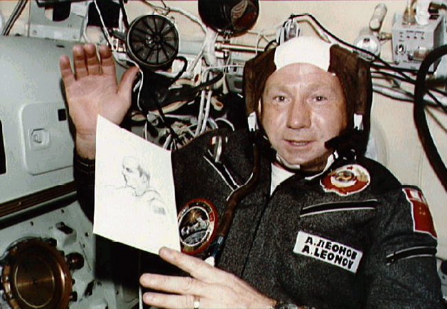 Alexei Leonov with a sketch of American astronaut Thomas Stafford during the Apollo-Soyuz mission (via NASA)