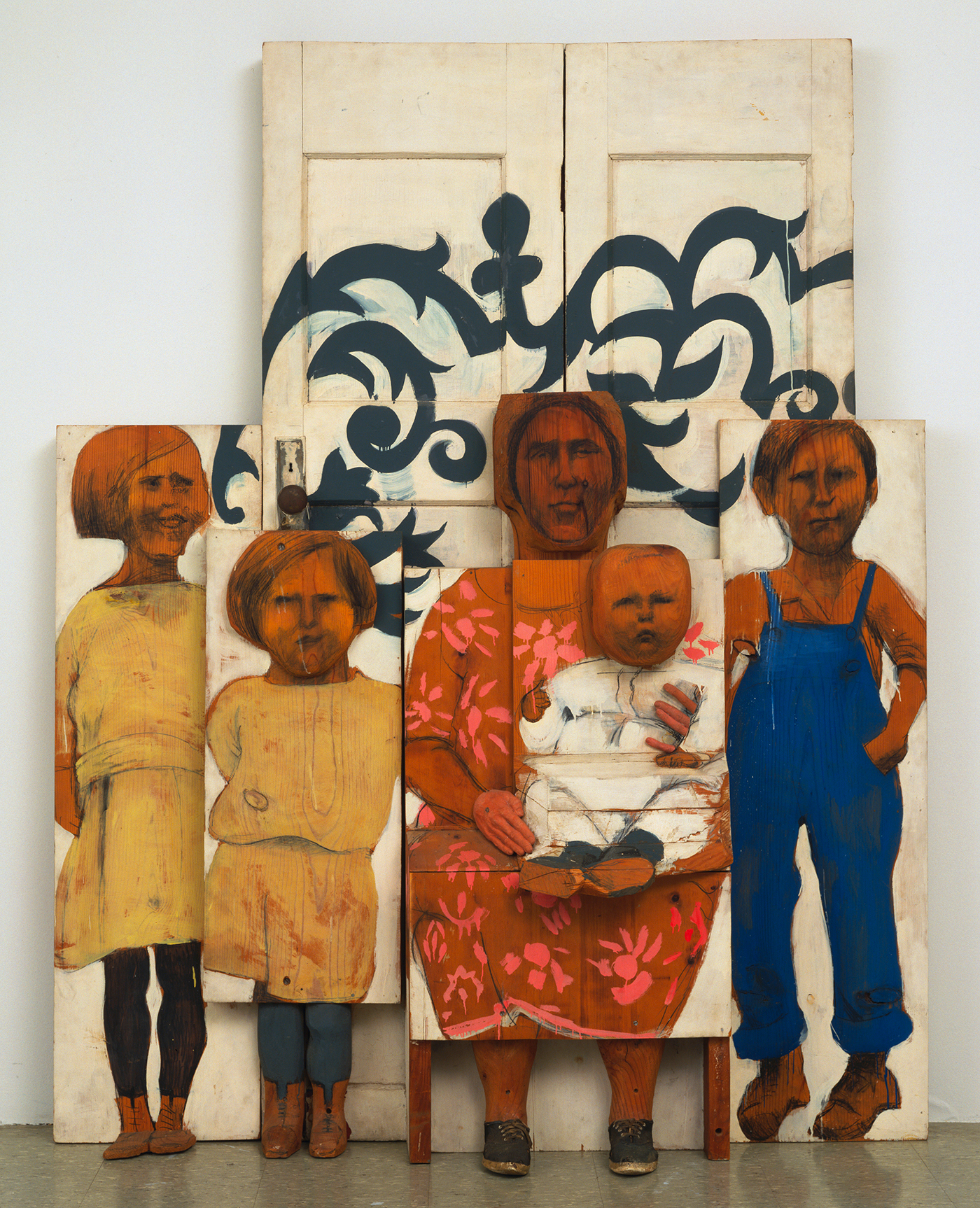 Marisol, "The Family" (1962), painted wood, sneakers, door knob and plate, three sections, overall dimensions 6' 10 5/8" x 65 1/2" x 15 1/2" (209.8 x 166.3 x 39.3 cm), The Museum of Modern Art, NY (© 2016 Marisol) 