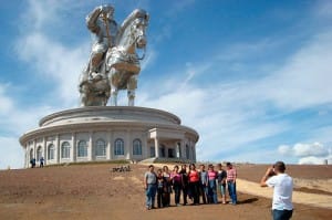Tourists pose for photos in front of a new, 40-meter-high statue of Genghis Khan about 50 kilometers from the Mongolian capital Ulaanbaatar. (Photo by Joshua Kucera)