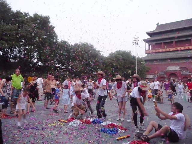 Both locals and expats enjoyed the "fireworks" beneath the historic Drum Tower in Beijing. Photo by An Xiao Mina.