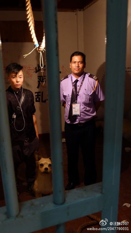 Li Wei and a Macanese police officer in her installation "Insignificant Civilization."