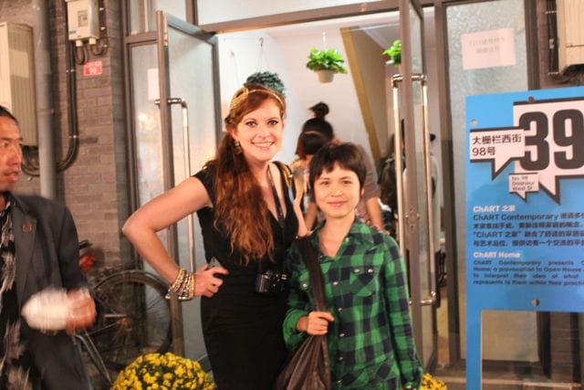 Curator KC Vienna Connolly with Chen Ke outside the installation site, a duplex on Dashilar.