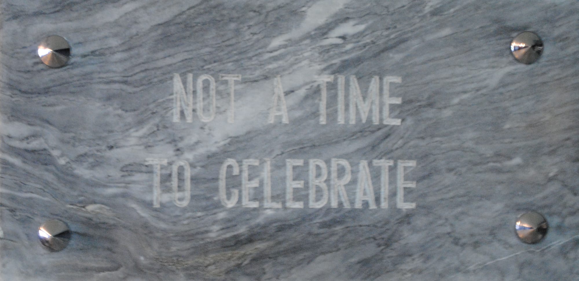 Dalena transfered the erased slogans to gravestones, which she commissioned from an actual gravestone craftsman.