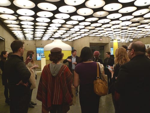 The #Whibi Twitter Tour group listens and live tweets curator Gary Carrion-Murayari's talk at the Whitney Biennial. Images by Nina Meledandri.