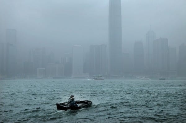 French photographer Christophe Jacrot's "La traversée" captures rainy scenes in different cities.