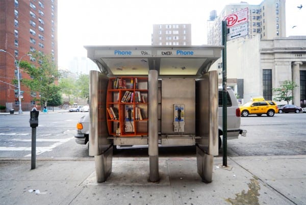 A phone booth on 96th St. outfitted with a bookshelf by the fictitious Department for Urban Betterment. Image via http://gracefulspoon.com.