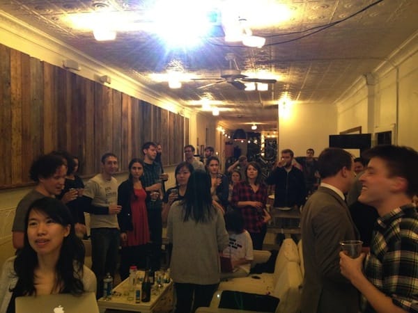 Kickstarter's office gathers in anticipation of passing the $1 million mark. Image via Kickstarter.com.