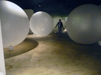 Artist Sylvia Heisel navigates the weather balloon maze. Image by the author.