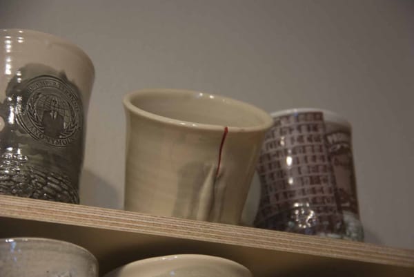 One cup’s telltale red wound