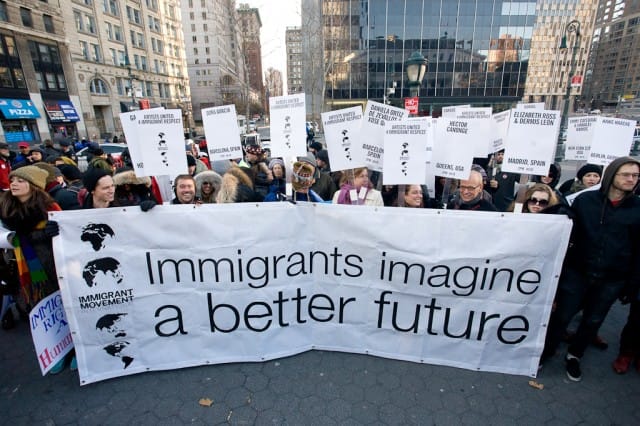 Creative Time staff, Tom Finkelpearl, Tania Bruguera and more marching for Immigrant Movement International. Image from Creative Time website.