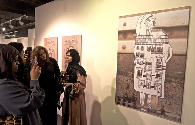 Sarah Al-Abdali with her work at Young Saudi Artists 2012