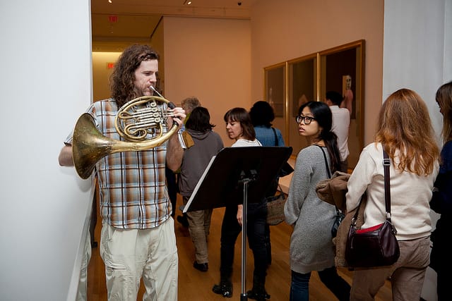 One of Galería Perdida's horn players