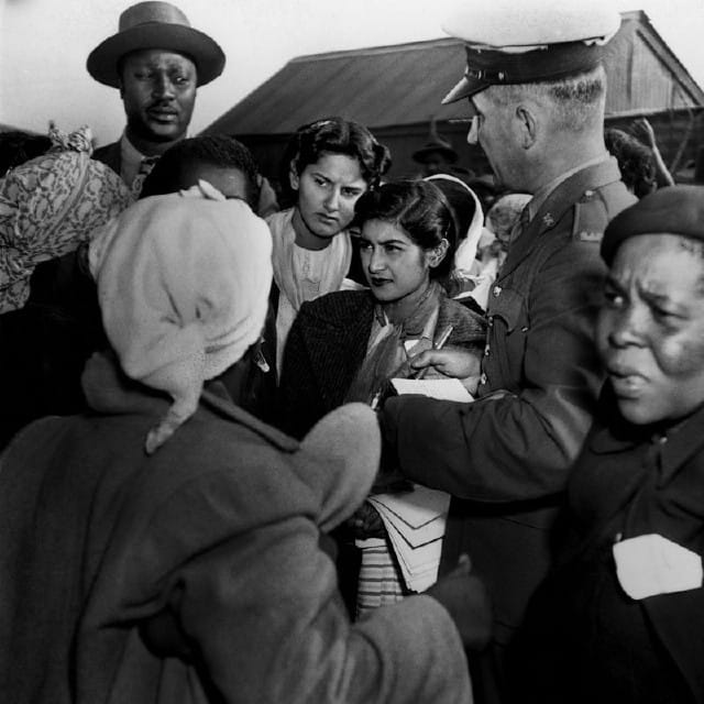 Jurgen Schadeberg, The 29 ANC Women’s League women are being arrested by the police for demonstrating against the permit laws, which prohibited them from entering townships without a permit, 26th August 1952. Courtesy the artist.