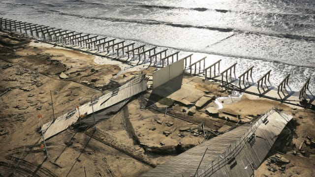 The wreckage of Rockaway Boardwalk, post-Sandy (Image via CNN.com)