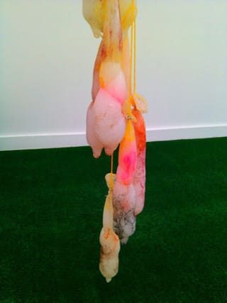 Dutes Miller, "Low Hanging Fruit" (2012), silicon, string, glitter, hardware, 140 x 5 x 5 inches (click to enlarge) (all photos by the author for Hyperallergic)