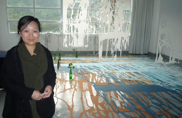 Elephant Vanishing with her work