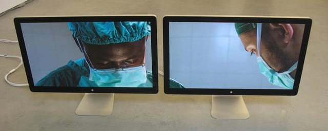 Massimo Grimaldi, “Emergency’s Surgical Center in Goderich, Photos Shown on Two Apple Thunderbolt Displays” (2013). Two Apple Thunderbolt displays, two Apple Mac Minis, double slideshow, dimensions variable, unique. Shown on Two Apple Thunderbolt Displays” (2013). Two Apple Thunderbolt displays, two Apple Mac Minis, double slideshow, dimensions variable, unique.