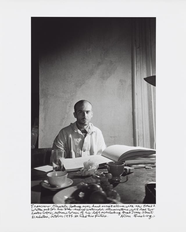 Allen Ginsberg, "Francesco Clemente looking over hand-script album with new poem I’d written out for his Blake-inspired watercolor illuminations, we’d done two books before; entrance corner of his loft overlooking Great Jones Street Manhattan, October 1984. He liked this picture." (1984) Gelatin silver print, printed 1984–97 15 7/8 x 10 5/8 in. (40.4 x 27 cm)