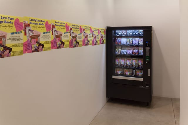 Temitayo Ogunbiyi, "Lovely Love Text Message Books" (2012), limited-edition books, vending machine, and currency; books: each 7 3/4 x 5 1/4 in; overall: 72 x 40 x 35 1/2 in (courtesy and © 2012 Temitayo Ogunbiyi)