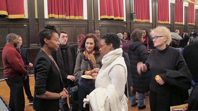 Walker speaks with guests after the program.