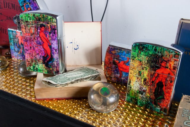Scott Ewalt, liberty and currency (1998-2012), the devil of today burlesk bible containing currency from strippers g-string and diamond and Giant Pinup Lighters (2013) (Photo: Mr. Means; Courtesy of Participant Inc.)