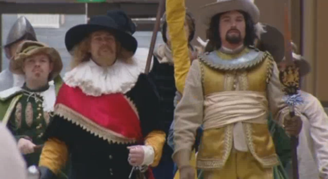 Reenactors in the mall (Screencapture by Hyperallergic from The Guardian)