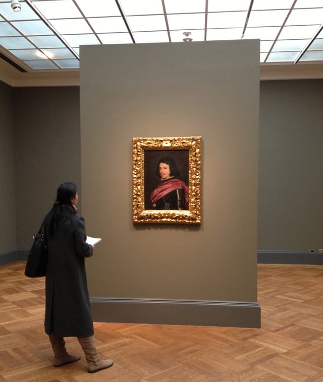 A woman gazing at Diego Velázquez's “Duke Francesco I d’Este” (1638) at the Metropolitan Museum of Art. (photo by the author for Hyperallergic)