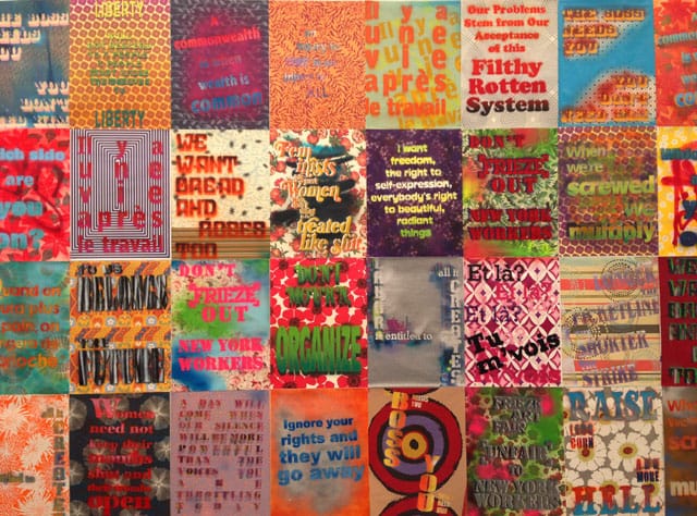 Protest signs by Andrea Bower at TK booth (photo by Hrag Vartanian for Hyperallergic)