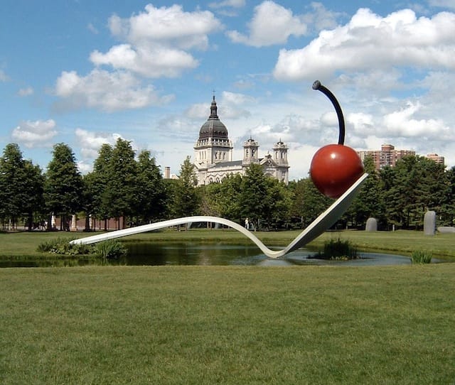 Claes Oldenburg, "Spoonbridge and Cherry."  Minneapolis Sculpture Garden, Walker Art Center, Minneapolis Stainless steel and aluminum painted with polyurethane enamel 29 ft. 6 in. x 51 ft. 6 in. x 13 ft. 6 in. (9 x 15.7 x 4.1 m) Commissioned February 1985 by the Walker Art Center Gift of Frederick R. Weisman in honor of his parents, William and Mary Weisman Installed May 9, 1988 Inaugurated May 11, 1988