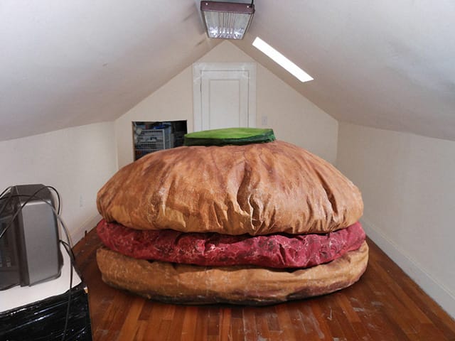 Claes Oldenburg's "Hamburger" in an attic room. (all images via greatartinuglyrooms.tumblr.com)