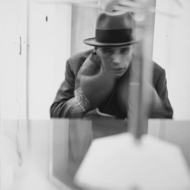 Joseph Beuys performing his piece "Felt TV" (photo by Lothar Wolleh, via Wikipedia)