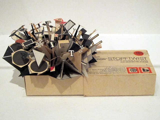 Sarah Bridgland, "Stopftwist Cotton Box (black, white and red)" (2010), paper, enamel paint, found cotton box, glue