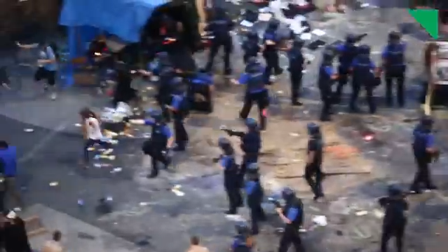 Swiss Police disperse protesters opposed to the "Favela Café" at Art Basel (screenshot by the author for Hyperallergic; original video below)