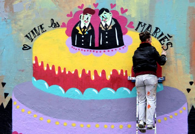 French street artist Kashink paints one of her distinctive murals that became a visual part of the recent push in France to legalize gay marriage. (via kashink.tumblr.com)