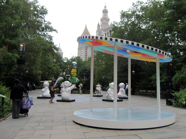 Daniel Buren, "Suncatcher" (2013), powder-coated steel, glass, vinyl pergola-garden trellis used for hanging flowers. light pavilion