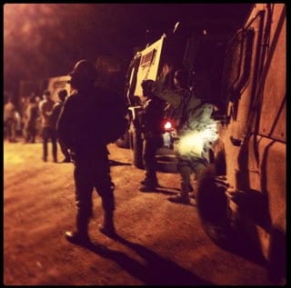 A soldier's shadowy Instagram photo of a nighttime raid (click to enlarge) (via electronicintifada.net)