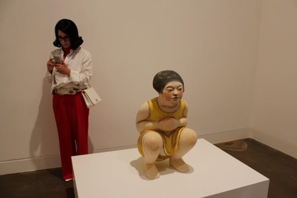 Seattle-based artist Akio Takamori produces intricately-made stoneware sculptures, such as “Squatting Girl in Yellow Dress,” from 2012, above.