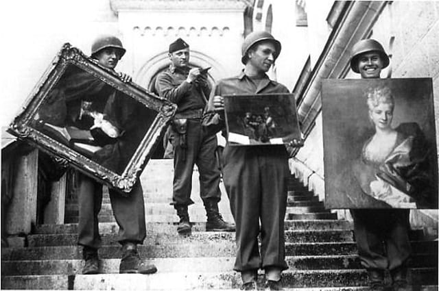 Monuments, Fine Arts, and Archives (MFAA) division recovering looted paintings from Neuschwanstein Castle in Germany during World War II (via National Archives)