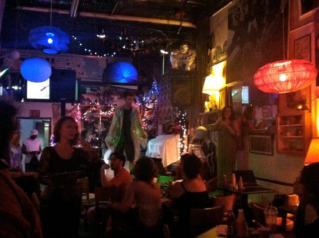 Marie Christine Katz (standing, far left) performs