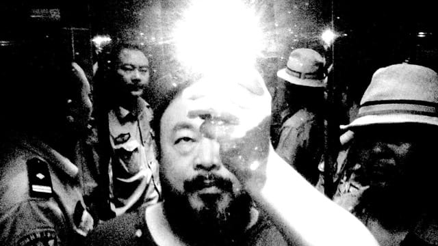 The cover of Ai Weiwei's "Divine Comedy" album is his infamous photo first posted on Twitter from during his detention.