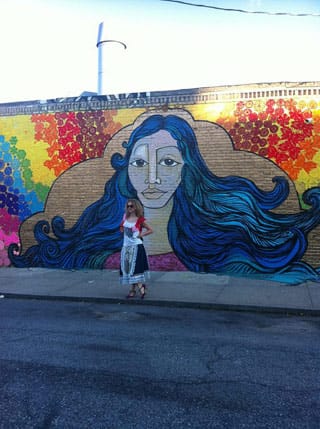 Olek in front of the Welling Court collaboration between her and Alice Mizrachi