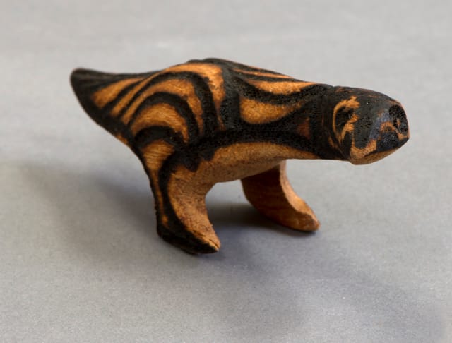 Carved punu (bird with pokerwork design) from Ernabella Arts Inc. Central Australia.