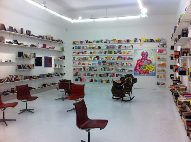 "Summer Reading" installation view with Paul Bright's zine collection (1993–2010) and Taylor McKimens' "Untitled" (2013), acrylic and flashe on canvas, 60 x 48 in (all photos by the author for Hyperallergic)