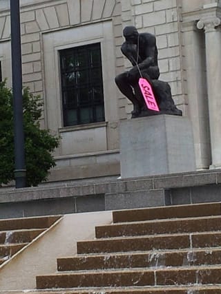 A tag sale sign on Rodin's "The Thinker" outside the Detroit Institute of Arts (photo by and courtesy Jon Parlangeli) (click to enlarge)