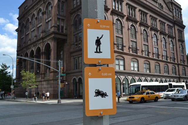 Signs for the statue of Lenin on Houston and Tom Otterness' "Coqui" (2005) in Astor Place (via NYCDOT)