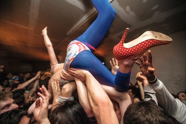 crowd surfing during a Spank Rock show at Bodega, Bushwick, Brooklyn, 2009.