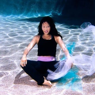Erica Yee poses underwater.