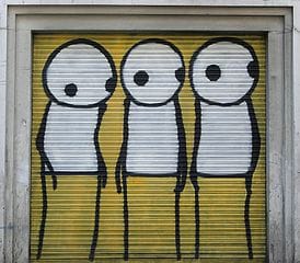 Street art by STIK in London (photograph by Bob Bob, via Wikimedia)